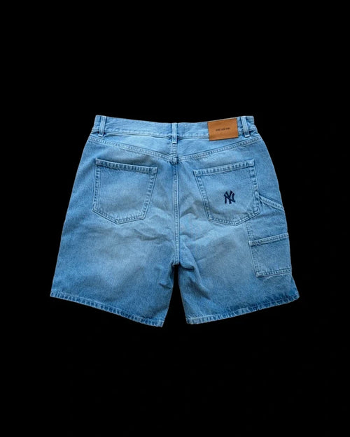 Aime Leon Dore blue denim shorts featuring New York Yankees logo and distressed details.
