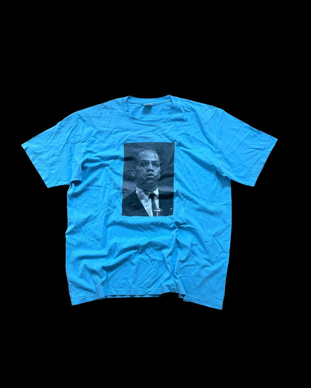 Supreme graphic tee blue featuring Malcom X print, part of Roy DeCarava collaboration.