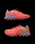 Nike Air Max Dn8 orange footwear with Palace logo and unique design details.
