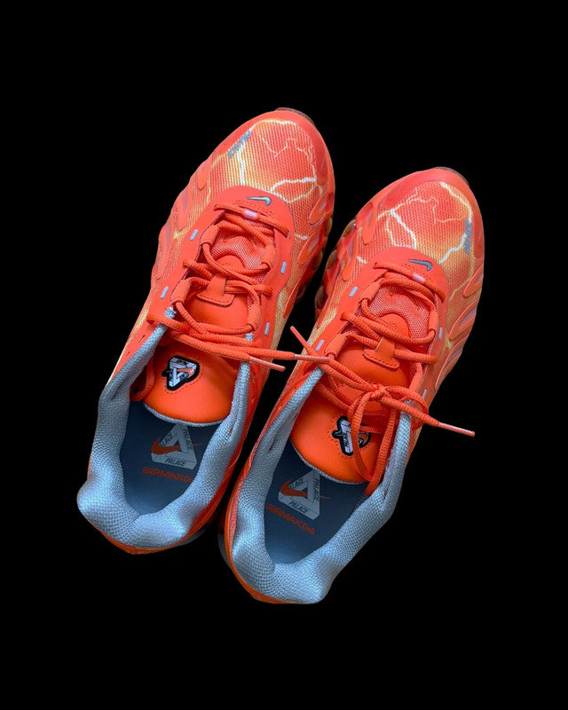 Nike Air Max Dn8 orange footwear with Palace logo and unique design details.