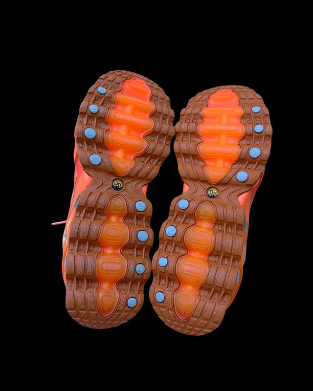 Nike Air Max Dn8 orange footwear with Palace logo and unique design details.