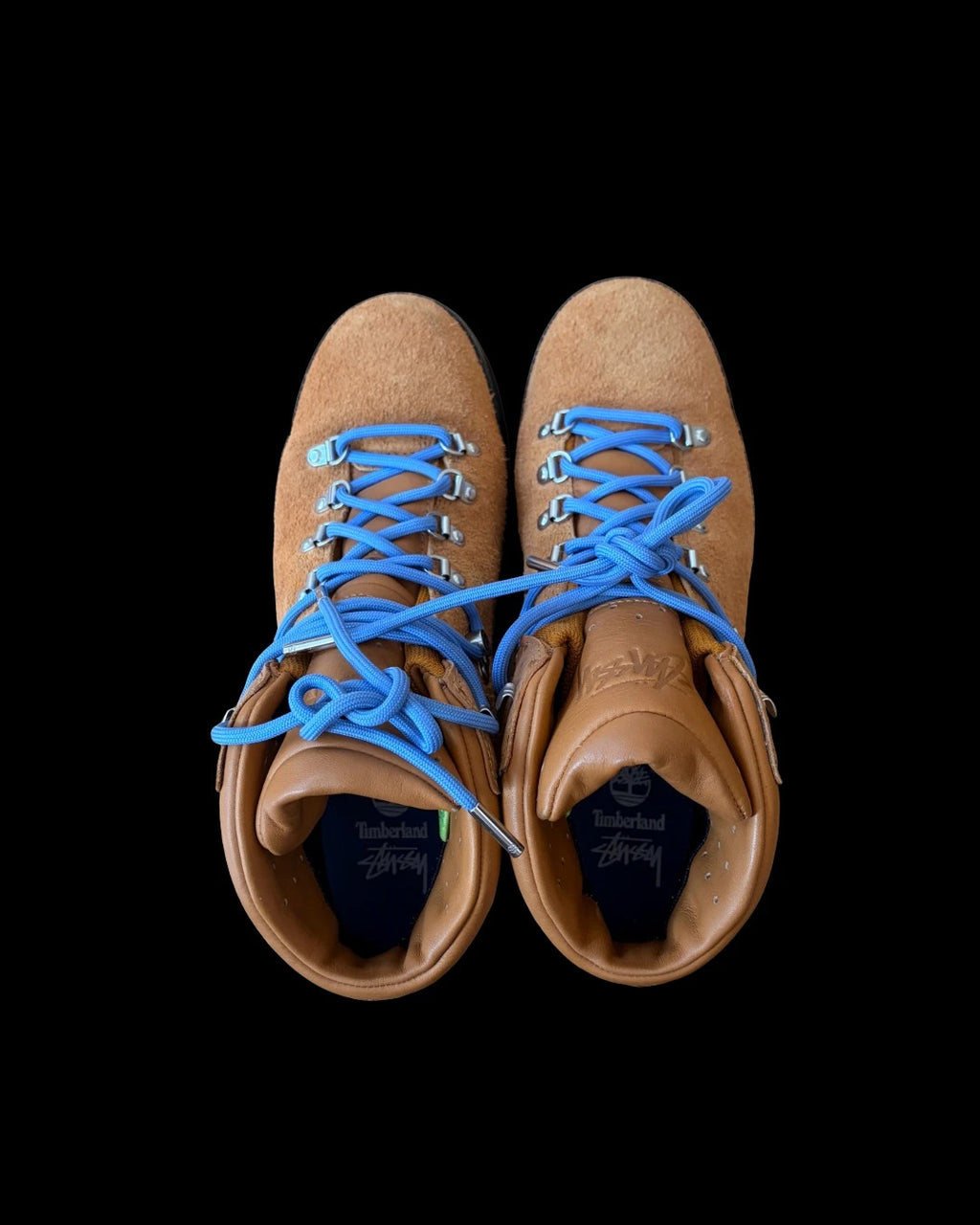 Stüssy x Timberland brown and orange hiking sandals with logo detailing and rugged sole.