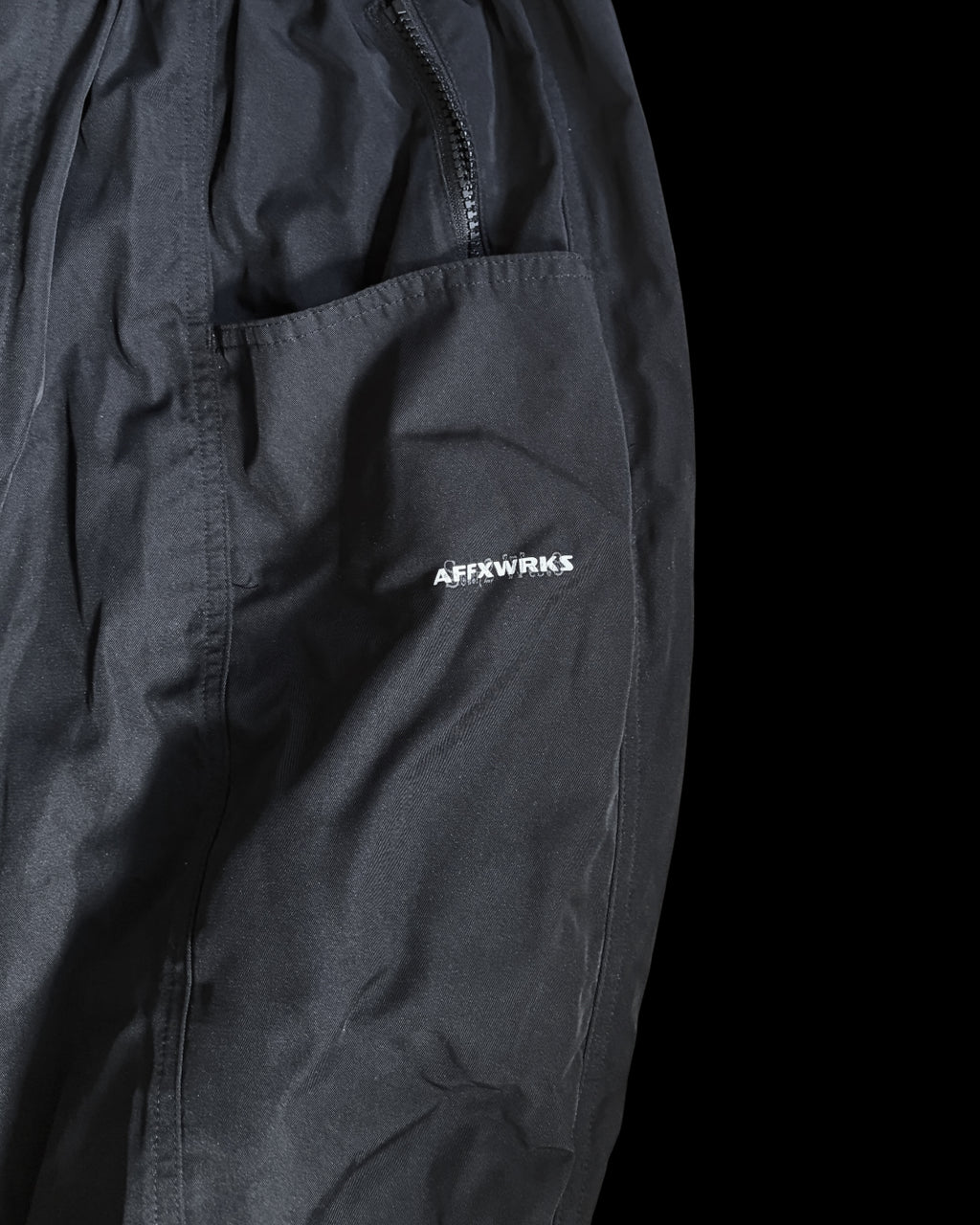 South 2 West 2 black activewear trousers, featuring logo details and premium material.