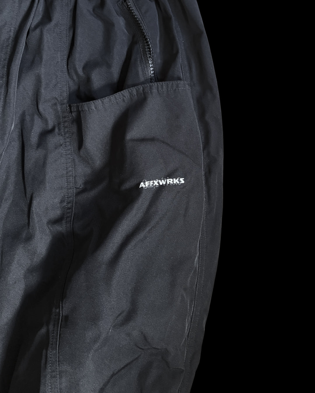 South 2 West 2 black activewear trousers, featuring logo details and premium material.